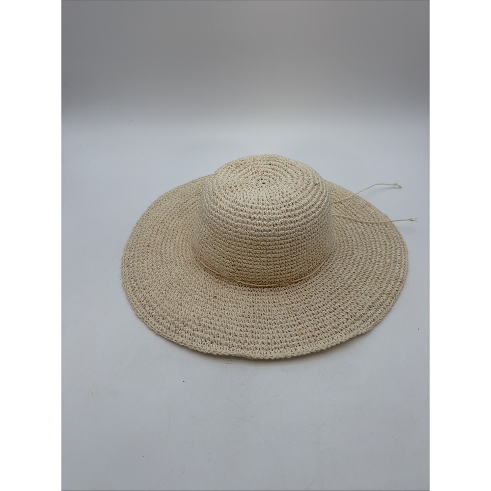 cream-colored crocheted straw sun hat features a classic wide brim